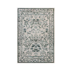 A rectangular area rug with a traditional floral and botanical pattern in muted sage green and gray on an off-white background, shown flat against a solid white background.