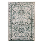 A rectangular area rug with a traditional floral pattern in muted sage green and gray on a warm off-white background, shown flat against a white studio backdrop.