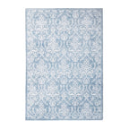 Soft blue rectangular rug featuring an intricate white damask floral pattern with a decorative border, 160 x 230cm.
