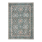 Design Republique Rihana Textured Green Rug featuring an intricate vintage-inspired floral and geometric pattern in shades of green, teal, rust and cream, finished with a decorative border.