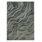 A forest green textured rug featuring an abstract flowing wave pattern in contrasting shades of dark and muted green against a white background.
