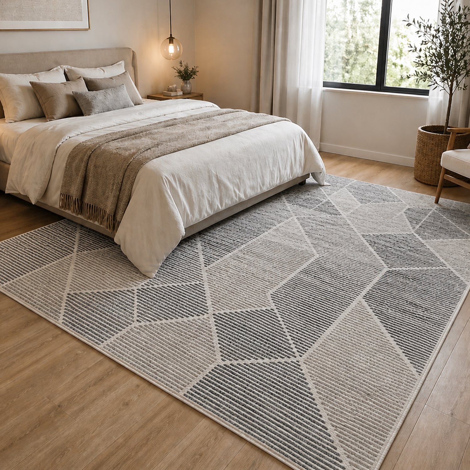 Luxury Living Serenity Geometric Rug 140 x 200cm in Multi Coloured, styled in a bedroom setting with an abstract geometric design in soft grey, cream and charcoal tones.