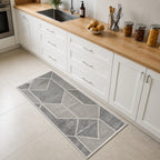 Luxury Living Serenity Geometric Rug 70 x 140cm in Multi Coloured, displayed as a runner in a modern kitchen with the same abstract geometric pattern.