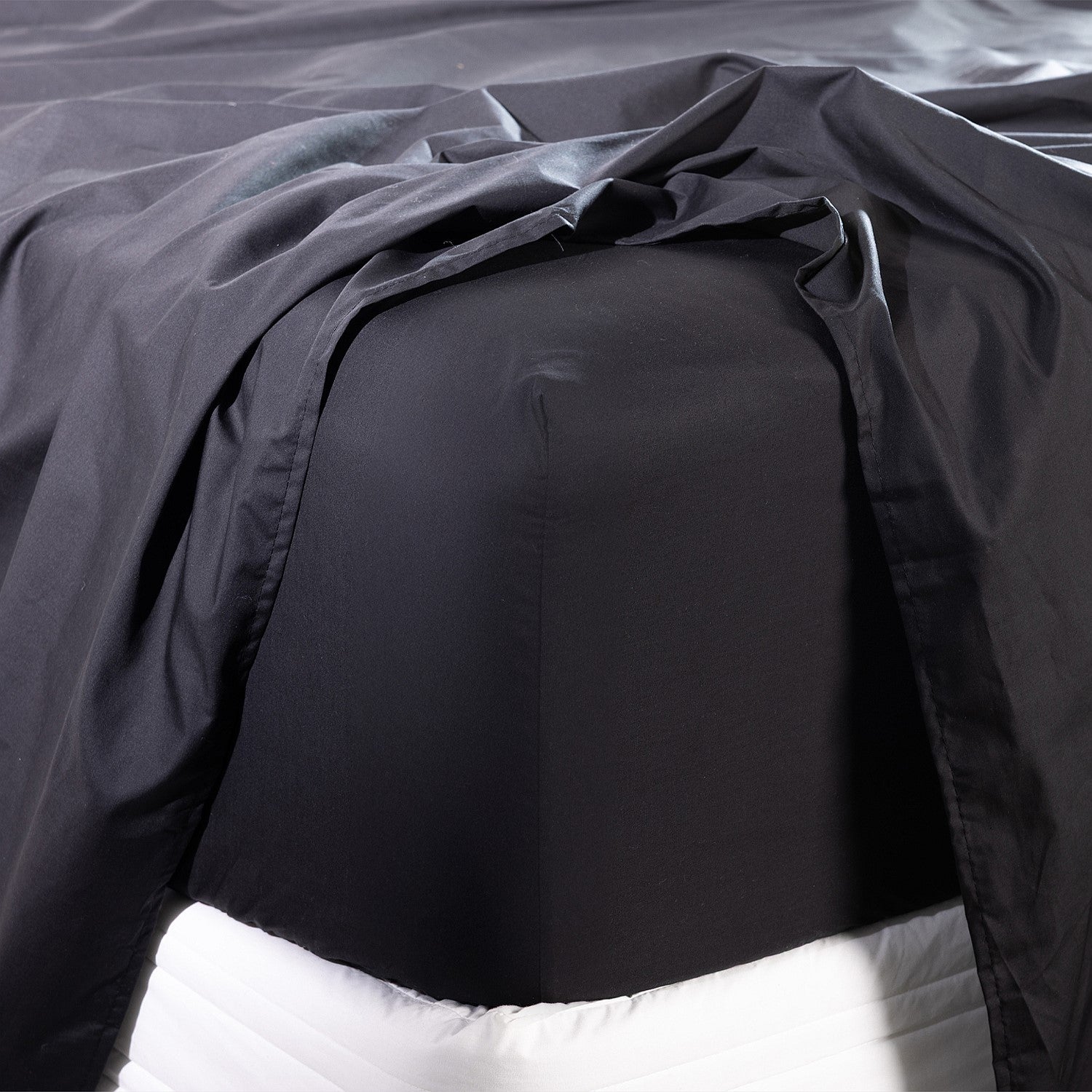 Close-up of a black fitted sheet