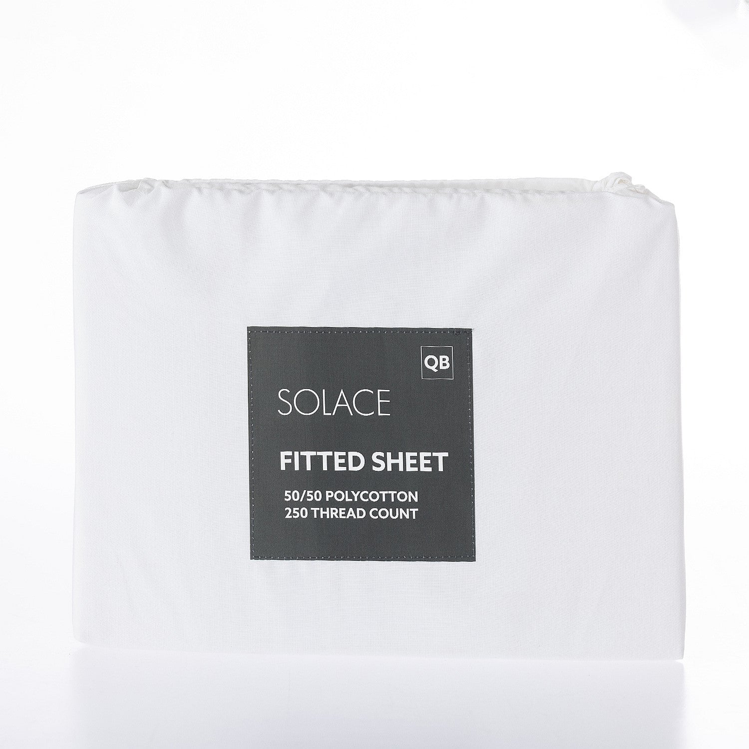 White fitted sheet with a label on a white background