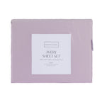 A folded Gracious Living Avery 750TC 100% Cotton Sheet Set in Dusky Mauve, featuring soft purple cotton sateen fabric and a branded product label, displayed against a white background.