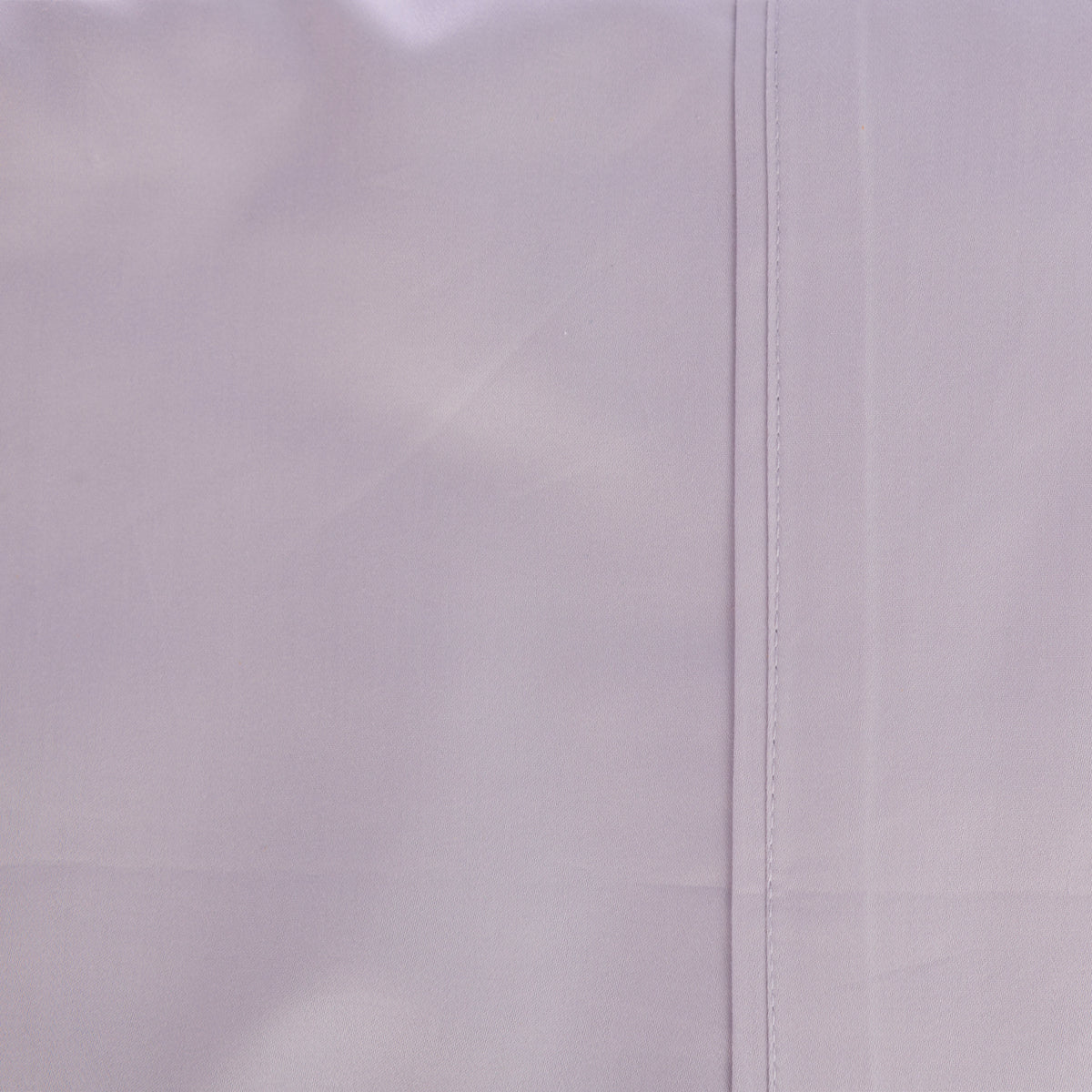 A close-up of the Gracious Living Avery Sheet Set in Dusky Mauve, showcasing the soft lavender-purple colour, smooth cotton sateen texture and neatly stitched seam detailing.