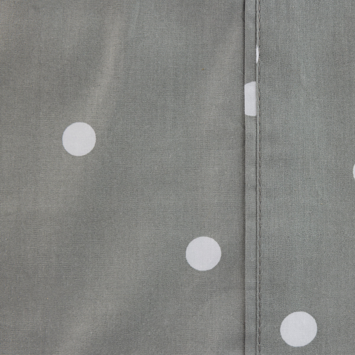 Close-up of the Pure & Simple Monroe Sheet Set in grey, showing the white polka dot pattern and stitched seam detail.