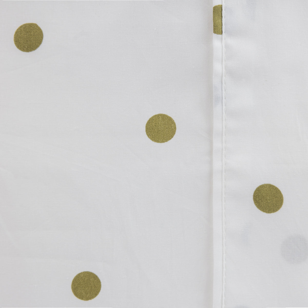 Close-up of the Pure & Simple Monroe Sheet Set in white and olive, showing the olive polka dot pattern and stitched seam detail.