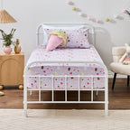 Ice Cream Shop fitted sheet set styled on a white metal bed with matching printed pillowcase and a playful ice cream cone cushion.