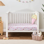 Ice Cream Shop fitted sheet styled on a white toddler bed with an oversized ice cream cone cushion and coordinating bedroom décor.