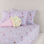 Ice Cream Shop fitted sheet set styled on a bed with matching printed pillowcases and a plush ice cream cone cushion.