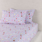 Ice Cream Shop fitted sheet set displayed with coordinating pillowcases, showing the colourful dessert-themed print across the bedding.