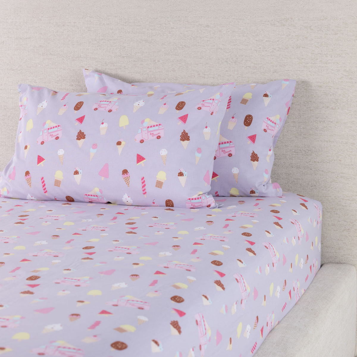 Ice Cream Shop fitted sheet set displayed with coordinating pillowcases, showing the colourful dessert-themed print across the bedding.