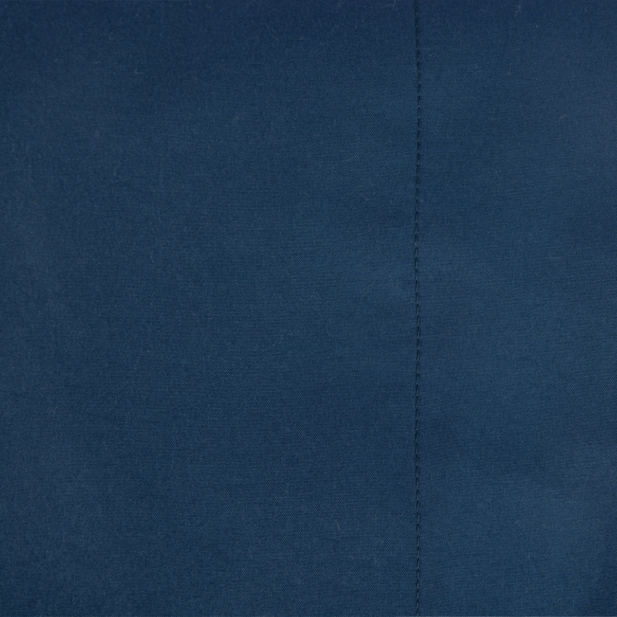 Close-up of the Home Co. Soft Touch Easy Care Sheet Set in Navy, showing the smooth fabric and stitched seam.