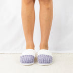 Person wearing Solace Chenille Faux Fur Trim Slippers in Lilac, featuring a soft chenille upper with plush white faux fur trim.