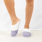 Person wearing Solace Chenille Faux Fur Trim Slippers in Lilac, featuring a soft chenille upper with plush white faux fur trim.