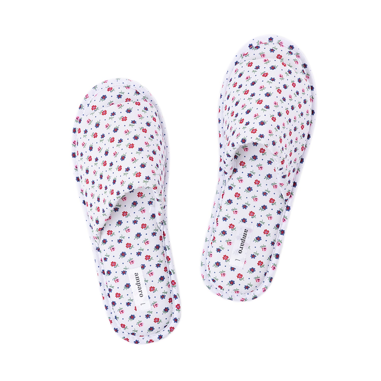 Pair of ivory floral open-toe slippers displayed on a white background.
