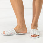 Solace Gracie Quilted Slippers Grey featuring a gingham check and pink floral print, shown worn from the side and front.