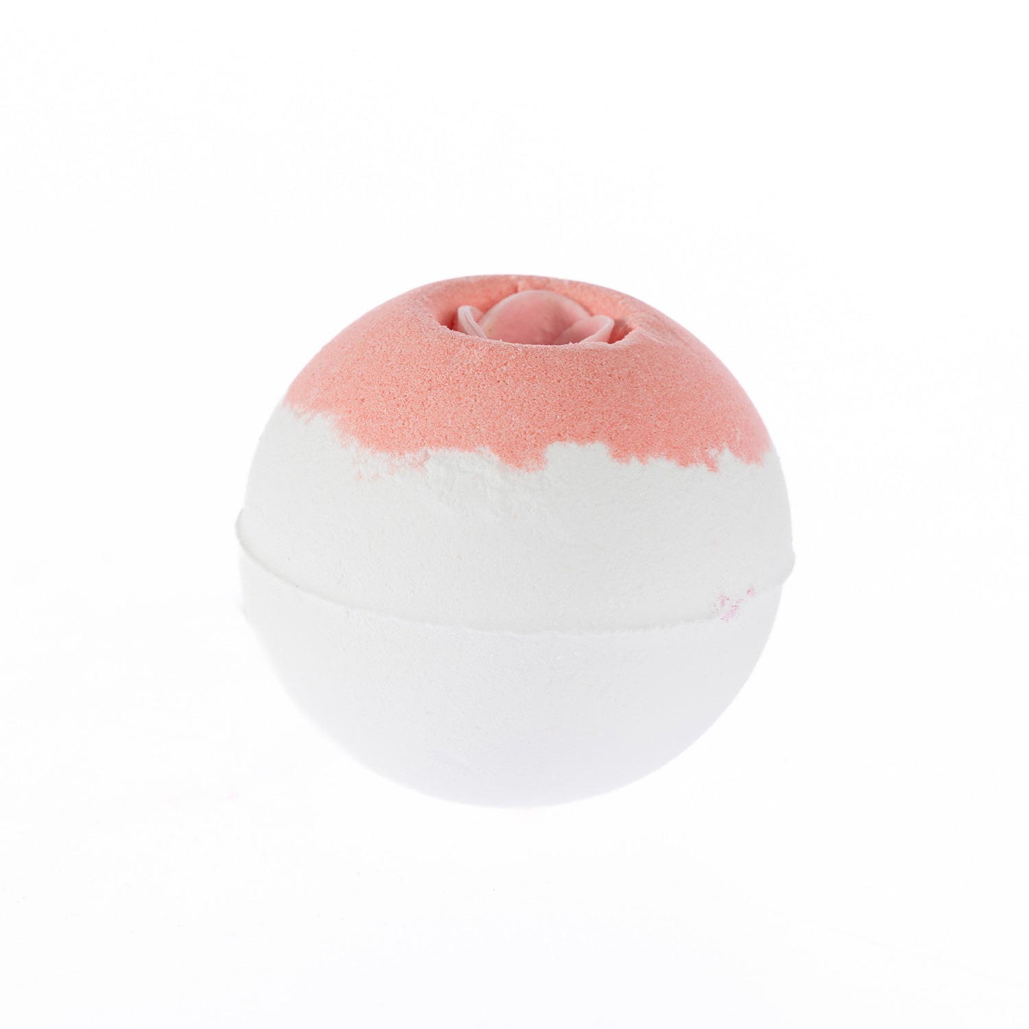 Round white bath fizzer with a soft pink top and a decorative rose-shaped centre, scented in Rose.