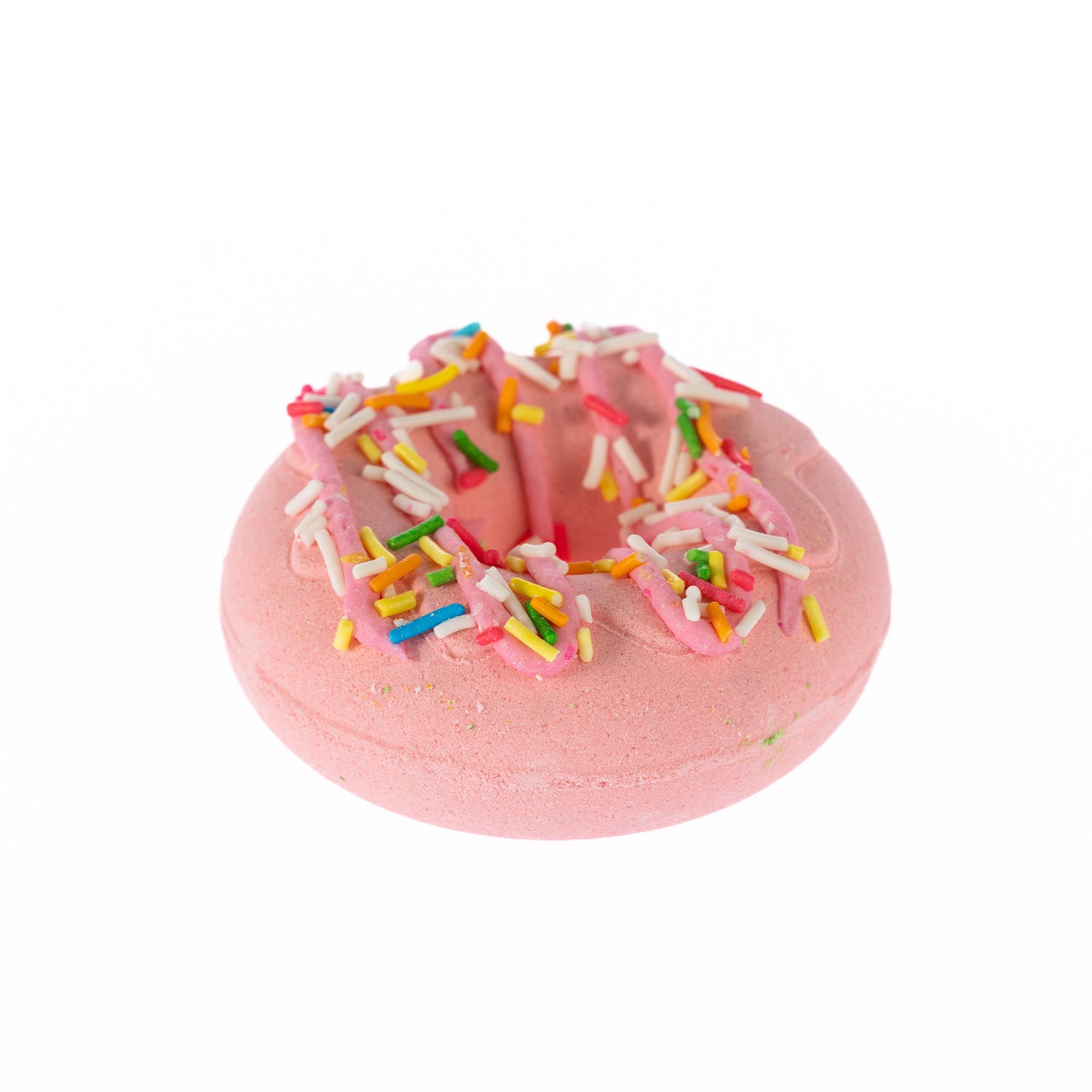 Pink doughnut-shaped bath fizzer topped with pink icing and colourful sprinkle decoration, scented in Cookie Dough.