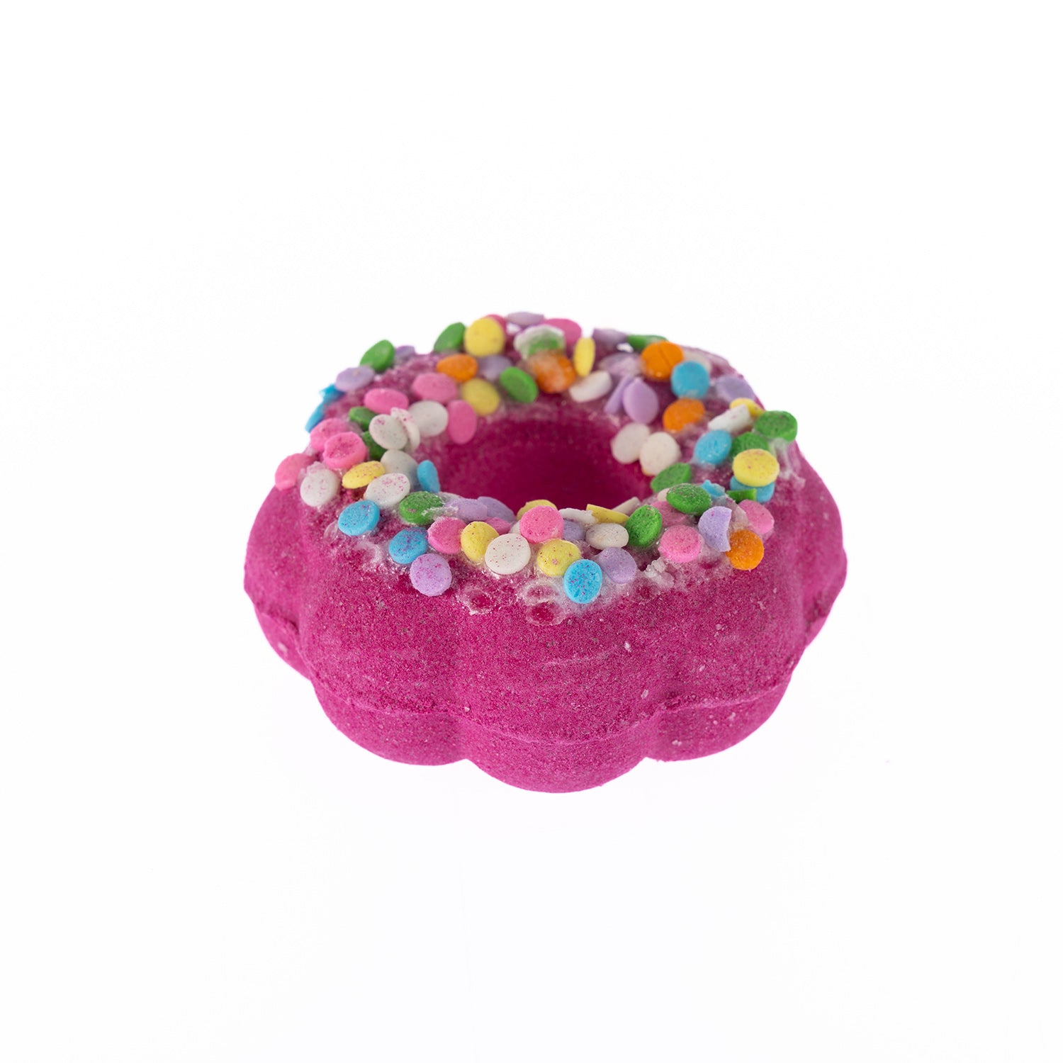 Pink flower-shaped doughnut bath fizzer topped with colourful sprinkle decoration, scented in Cookie Dough.