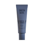 Smith & Co. Smoked Suede & Bergamot Hand & Nail Pomade 80ml in a dusty blue tube against a plain white background.