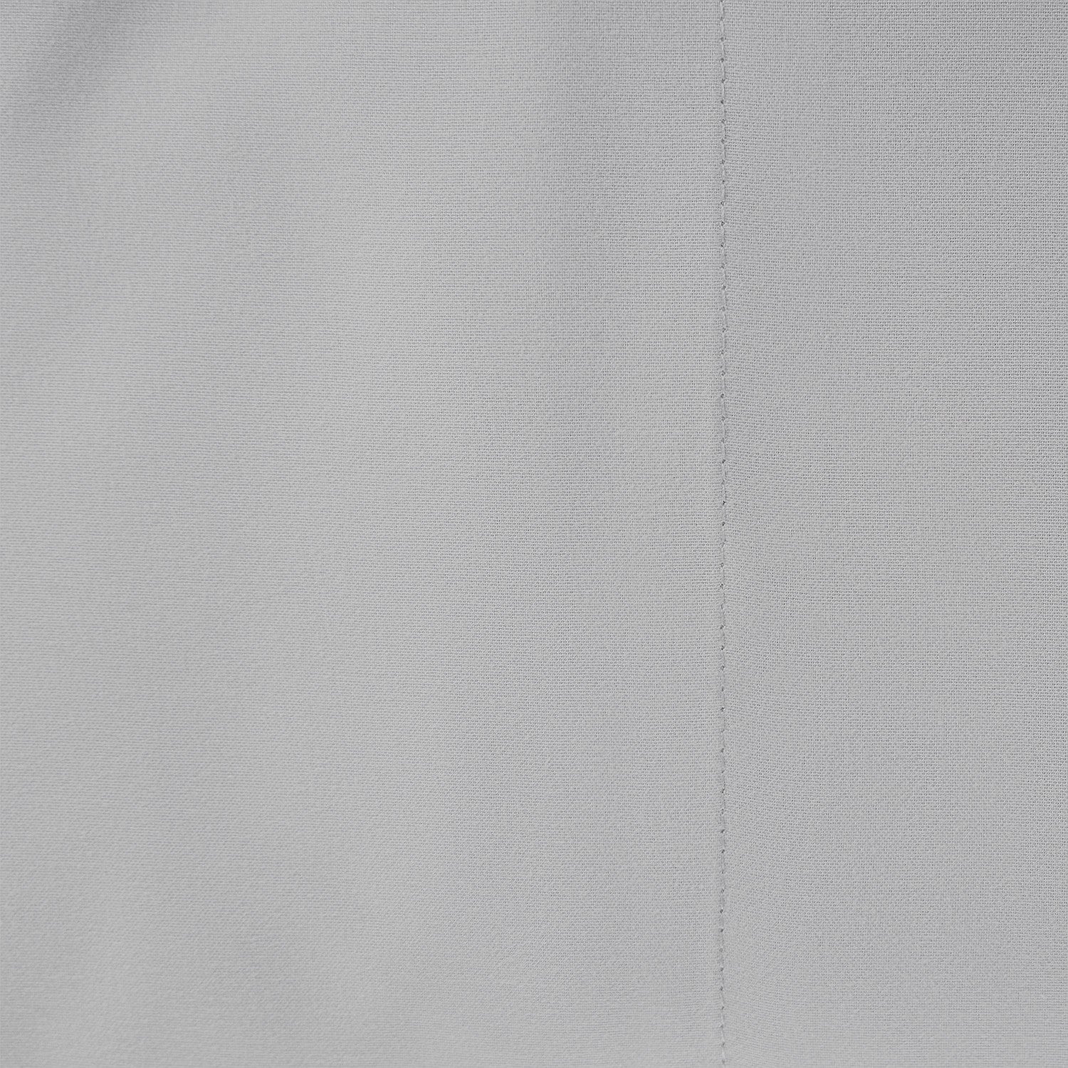 Close-up of gray fabric with a visible seam
