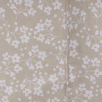 Close-up of the Home Co. Florance Natural printed sheet set with a subtle textured botanical pattern.