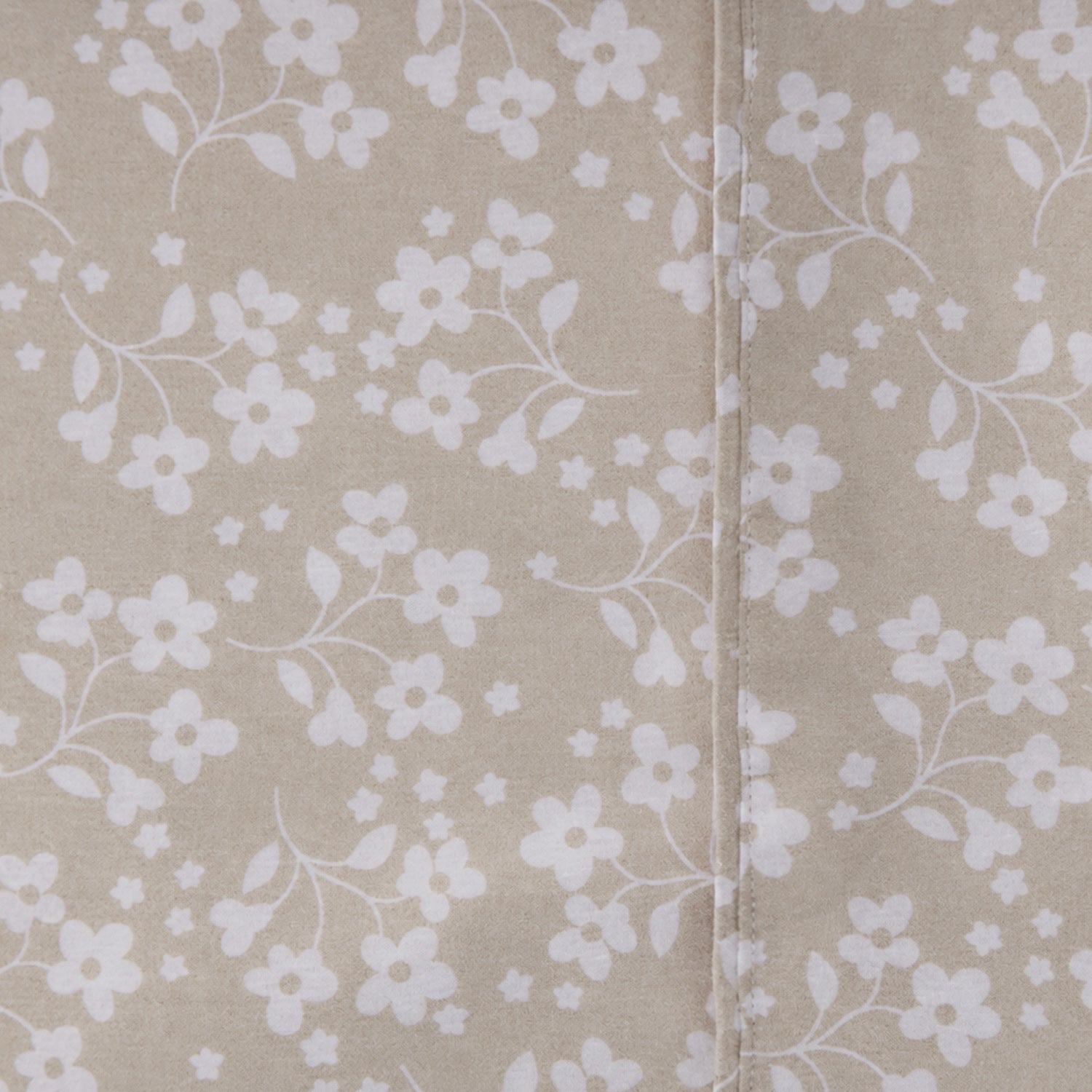 Close-up of the Home Co. Florance Natural printed sheet set with a subtle textured botanical pattern.