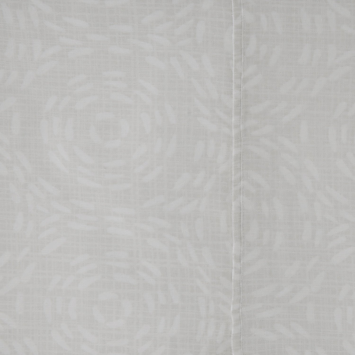 Close-up of the Home Co. Florance Silver printed sheet set featuring a white floral pattern on a soft silver background.