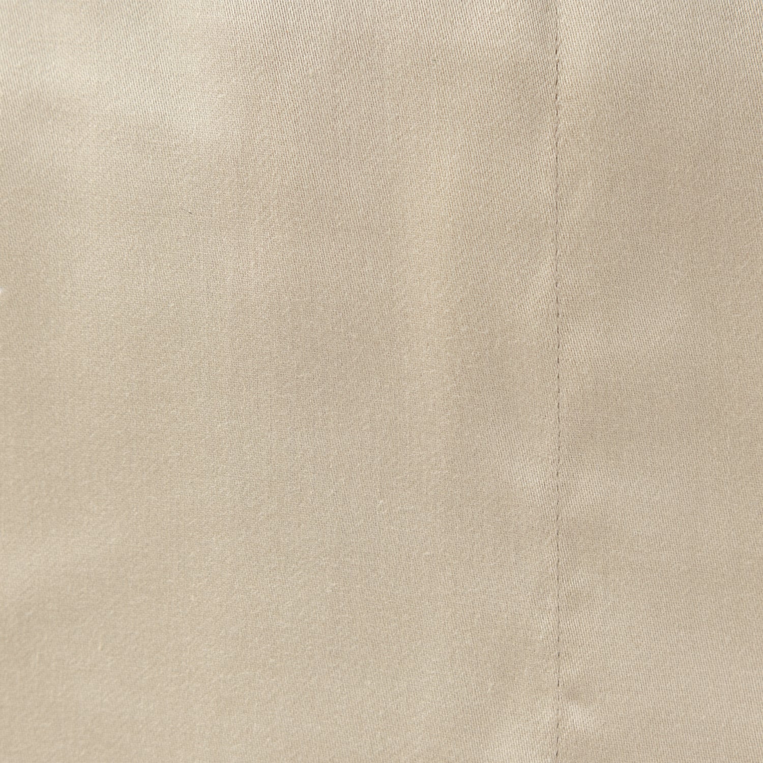 Close up of the Design Plus Duke Sheet Set in Beige, showing the plain cotton fabric texture.