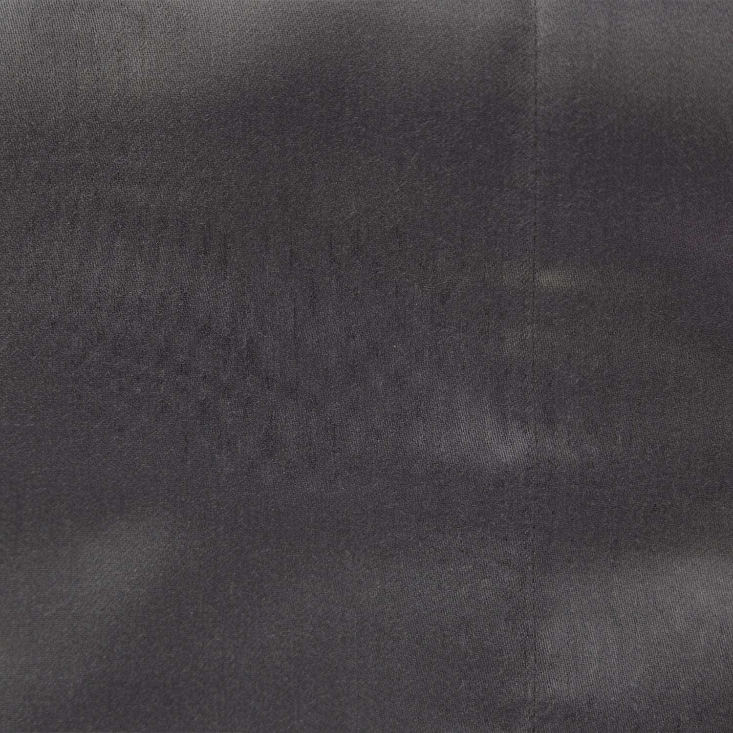 Close up of the Design Plus Duke Sheet Set in Charcoal, showing the plain cotton fabric texture.