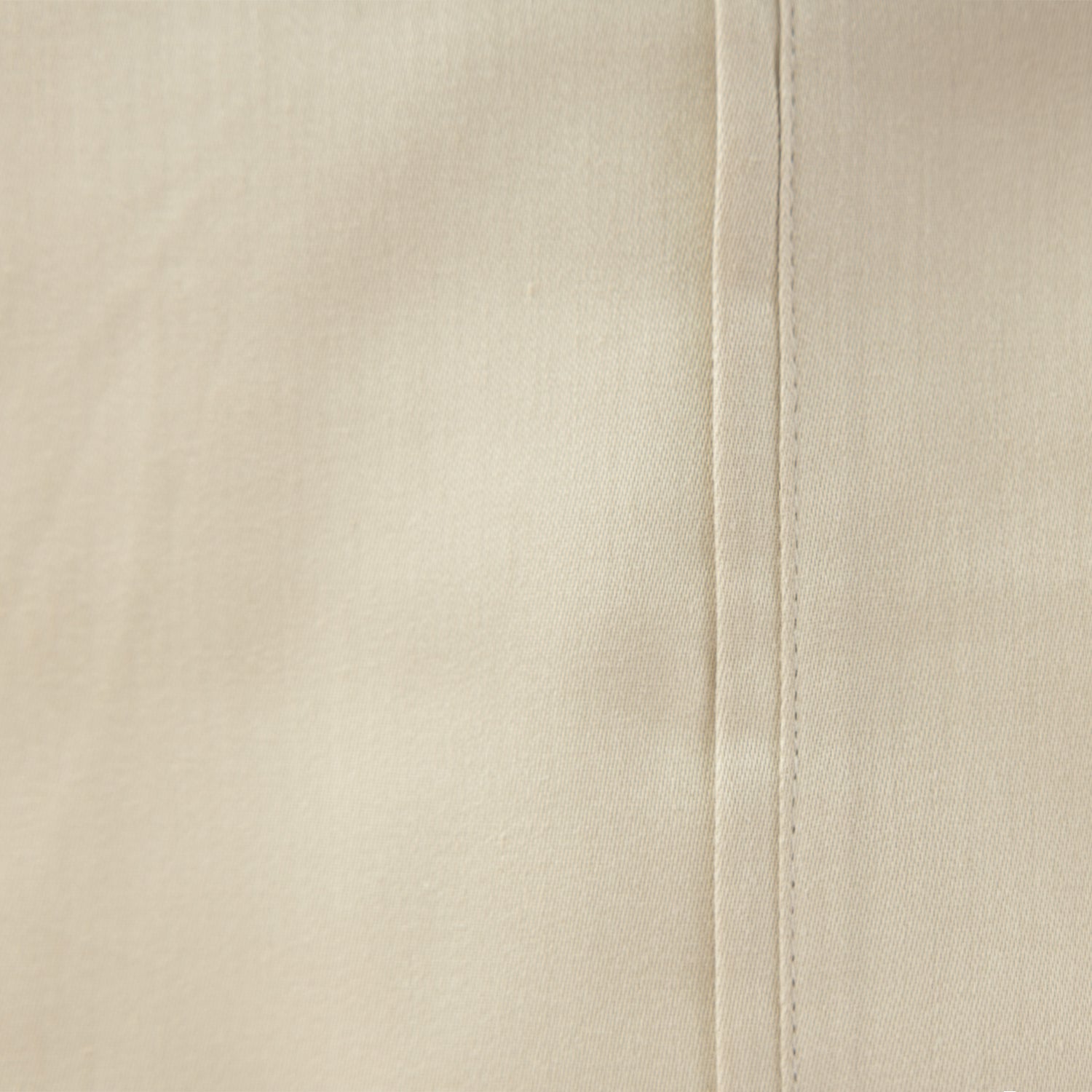 beige sheet laid out up close.