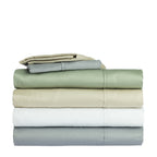 Folded cotton sheet sets stacked in soft green, beige, white and grey colours.