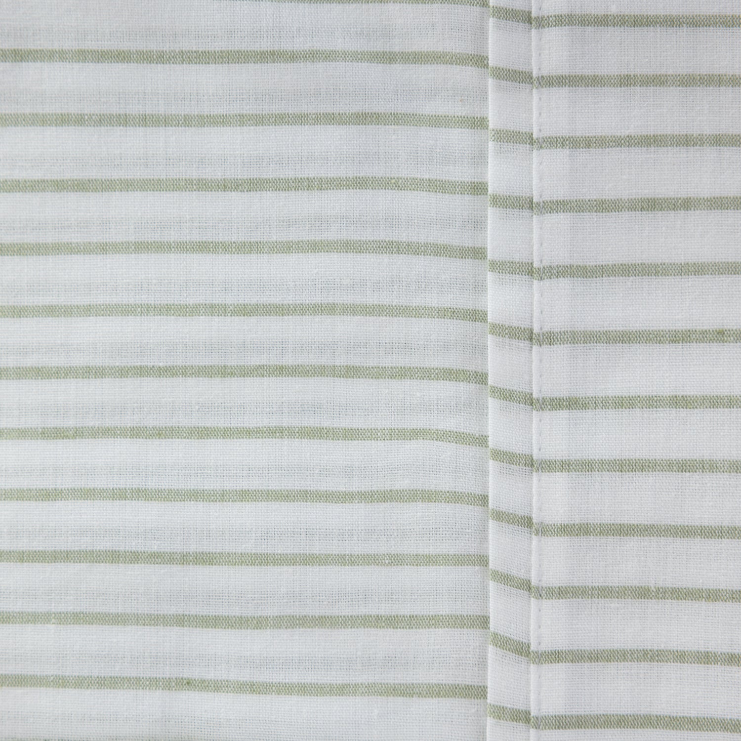Close-up of the Pure & Simple Sutton olive sheet set featuring fine green horizontal stripes on white cotton fabric.