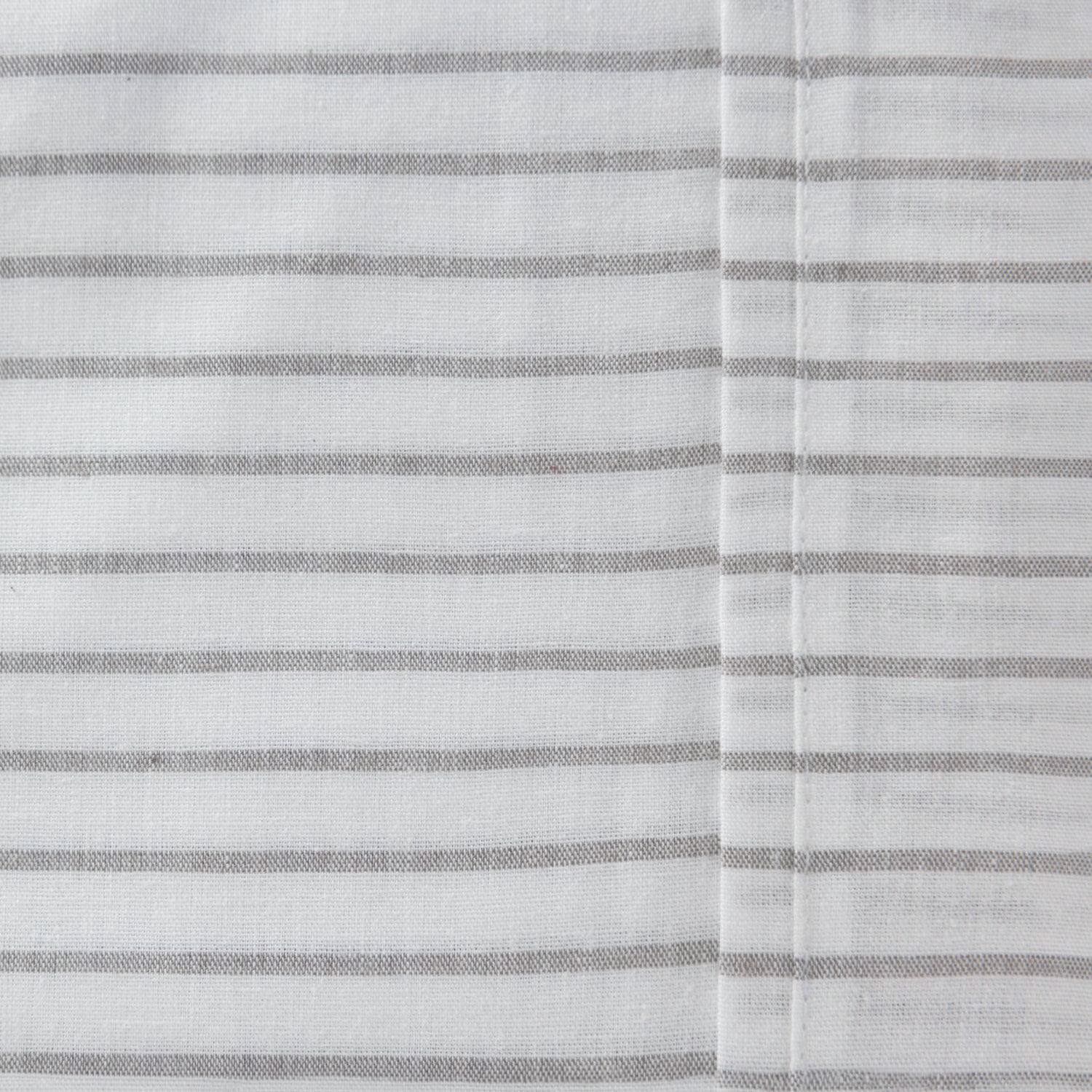 Close-up of the Pure & Simple Sutton silver sheet set featuring fine grey horizontal stripes on white cotton fabric.