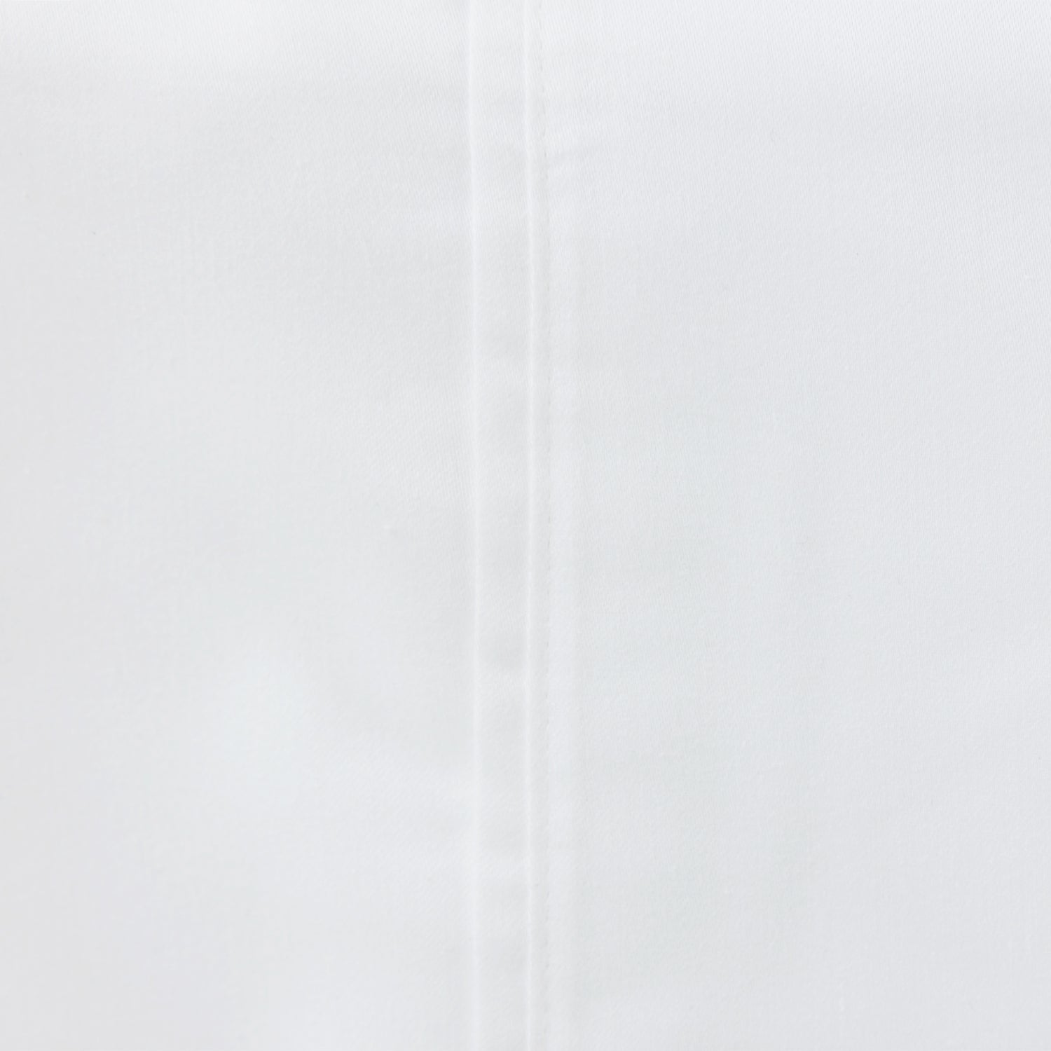 Close-up of the Solace Satin Sheet Set in White, showing the smooth satin-look fabric and stitched seam detail.