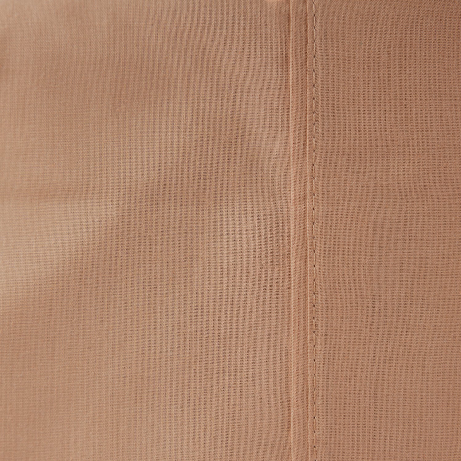 Close-up of the Home Co. Ella Cotton Sheet Set in Pink Clay, highlighting the warm peach-pink colour and woven cotton texture.