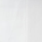 Close-up of the Home Co. Ella Cotton Sheet Set in White, showing the smooth woven cotton fabric and stitched seam detail.