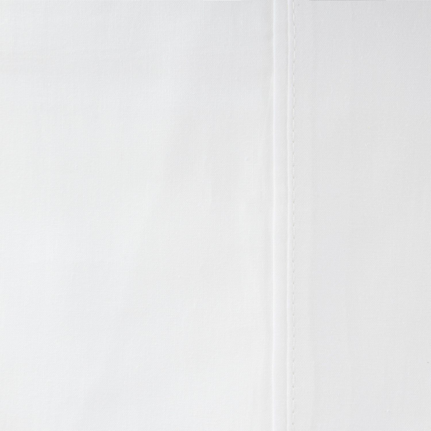 Close-up of the Home Co. Ella Cotton Sheet Set in White, showing the smooth woven cotton fabric and stitched seam detail.