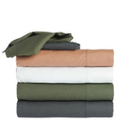 Folded Home Co. Ella 180TC Cotton Sheet Sets stacked together in Olive, White, Pink Clay and Charcoal.