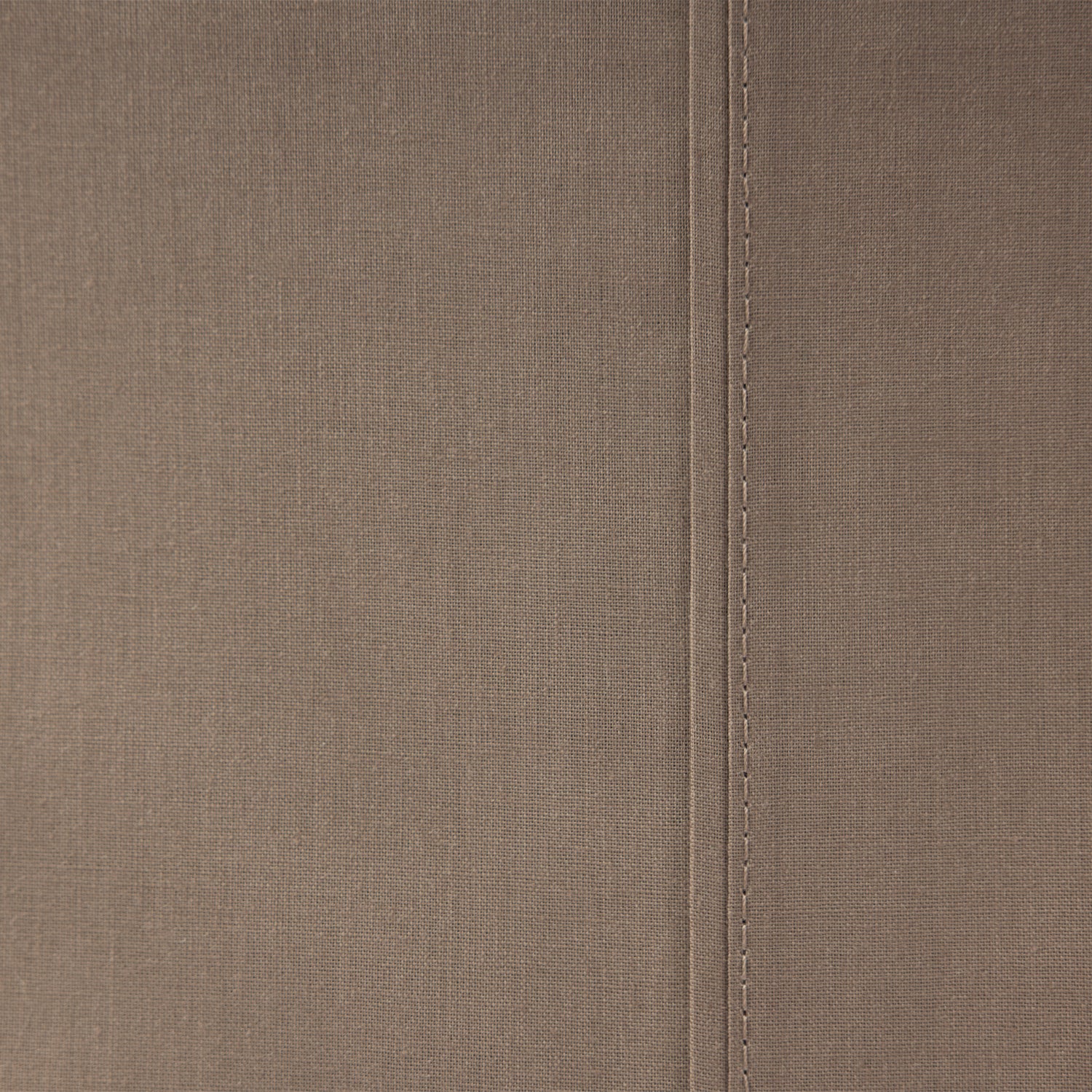 Close-up of the Home Co. Ella Cotton Sheet Set in Mocha, highlighting the warm brown tone and stitched seam detail.