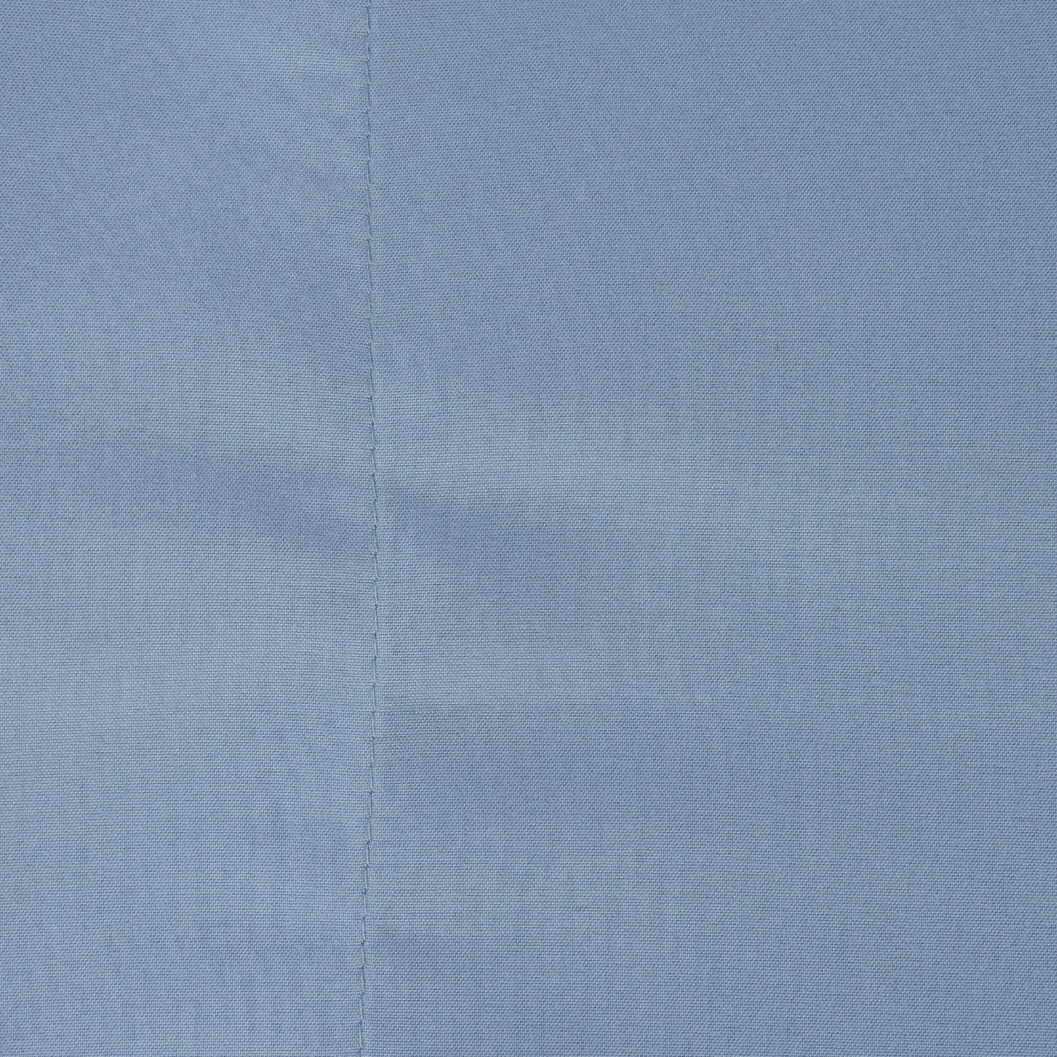 A close-up of a blue sheet. 
