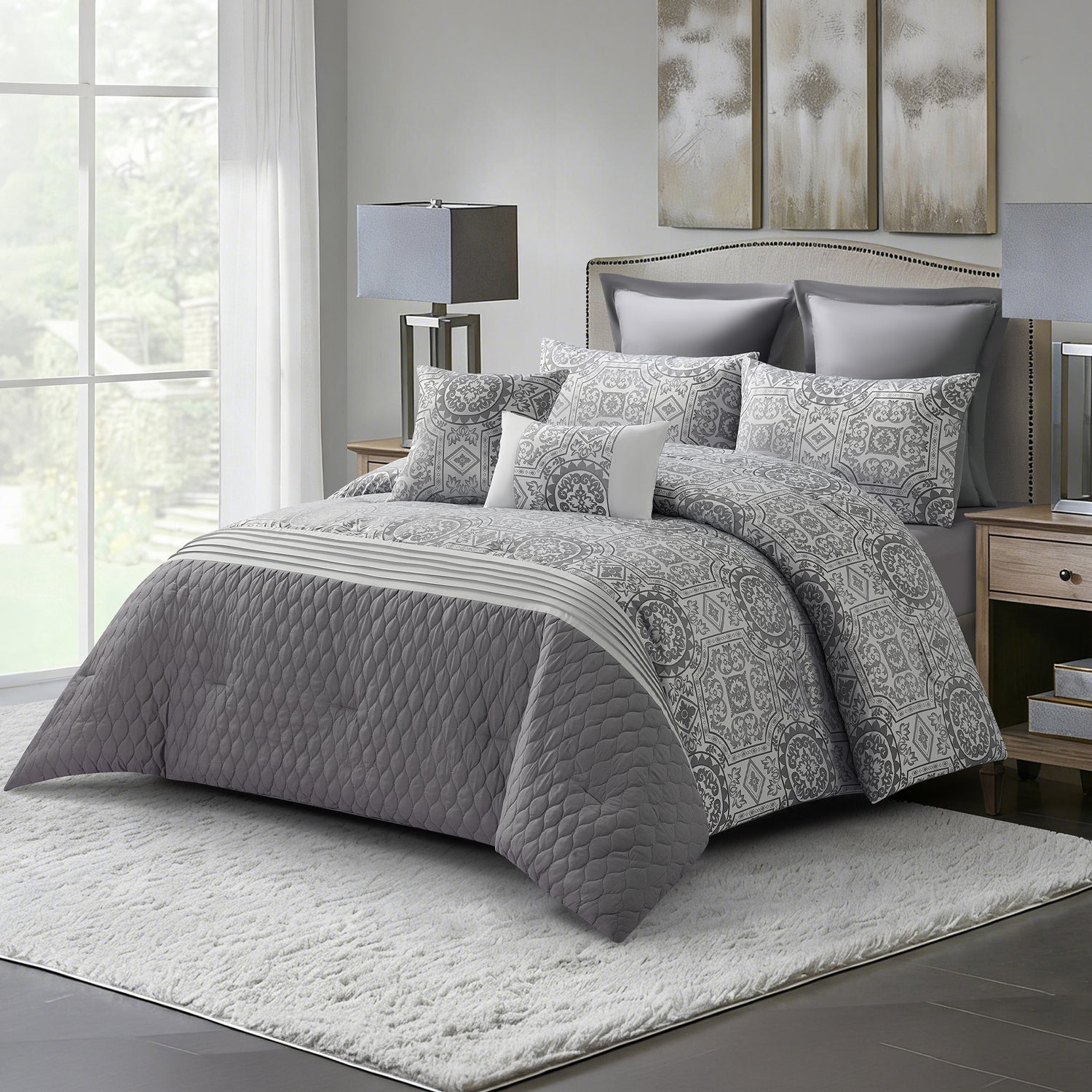 Grey quilted comforter set styled on a bed with matching pillows in a modern bedroom.