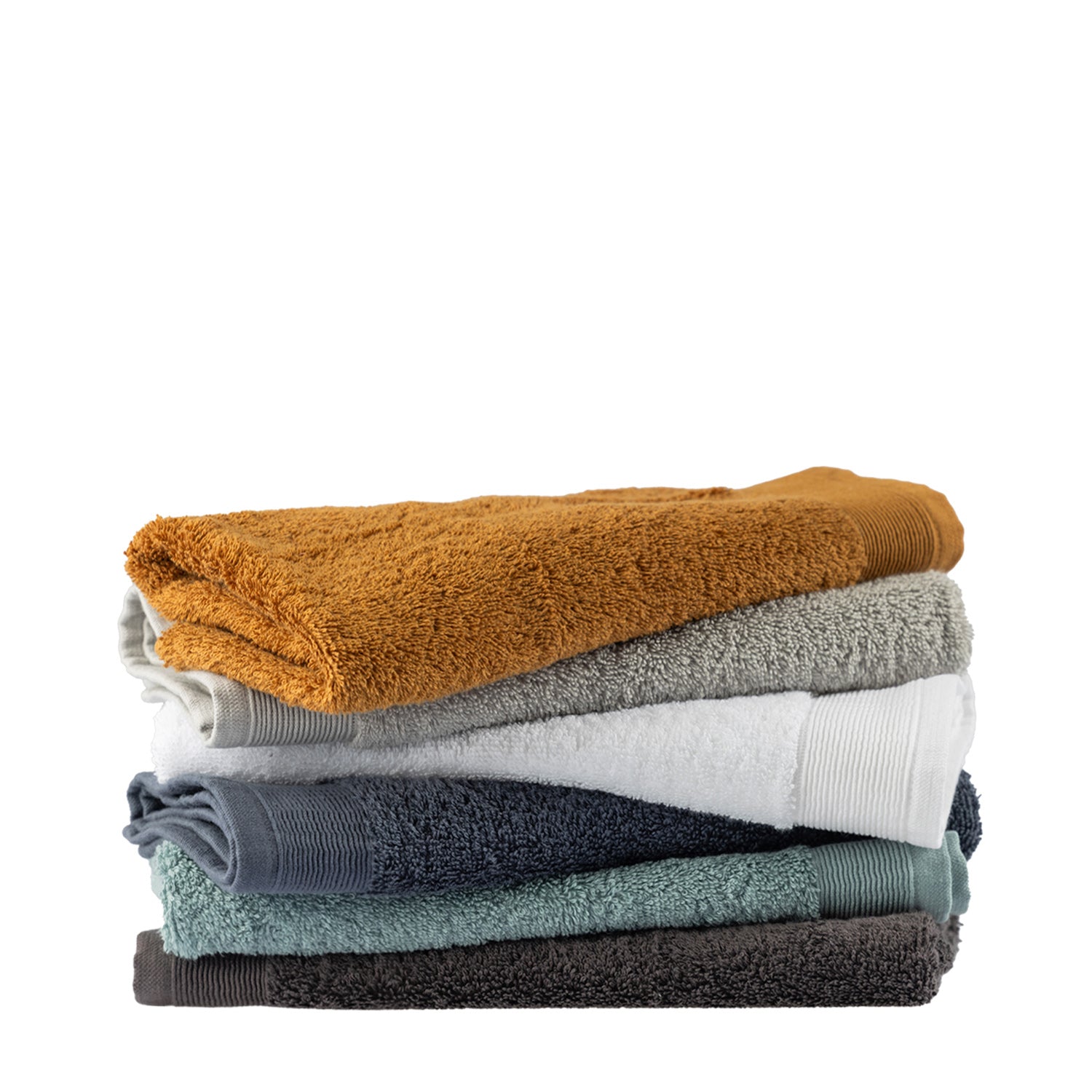 Stack of folded Egyptian cotton hand towels in Marigold, Silver, White, Diesel Blue, Marine and Charcoal colourways.
