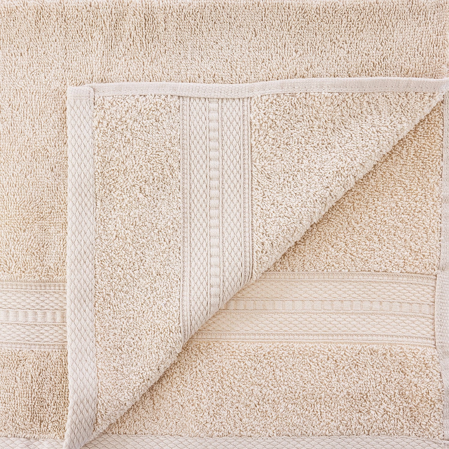 Close-up of a textured beige rug with geometric pattern