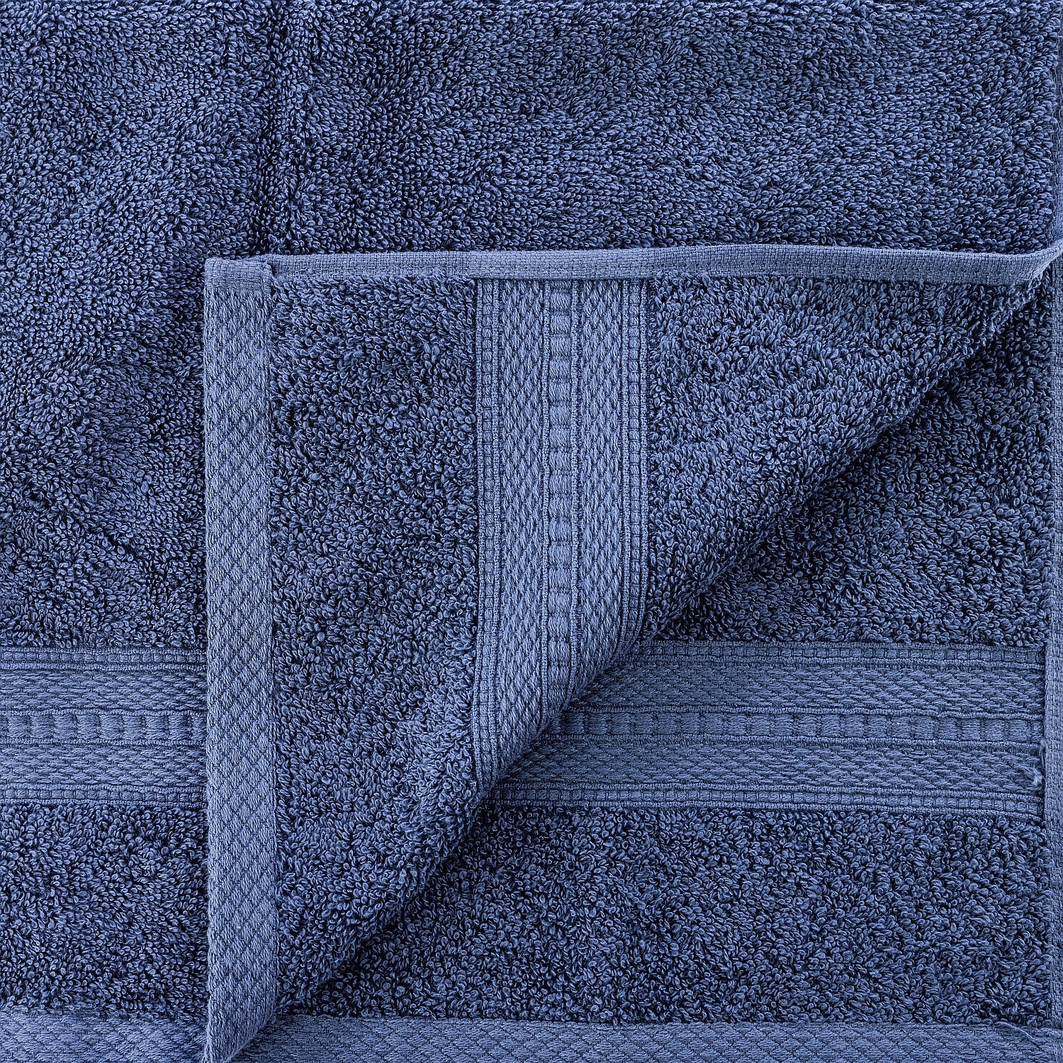 Close-up of a blue towel with textured border