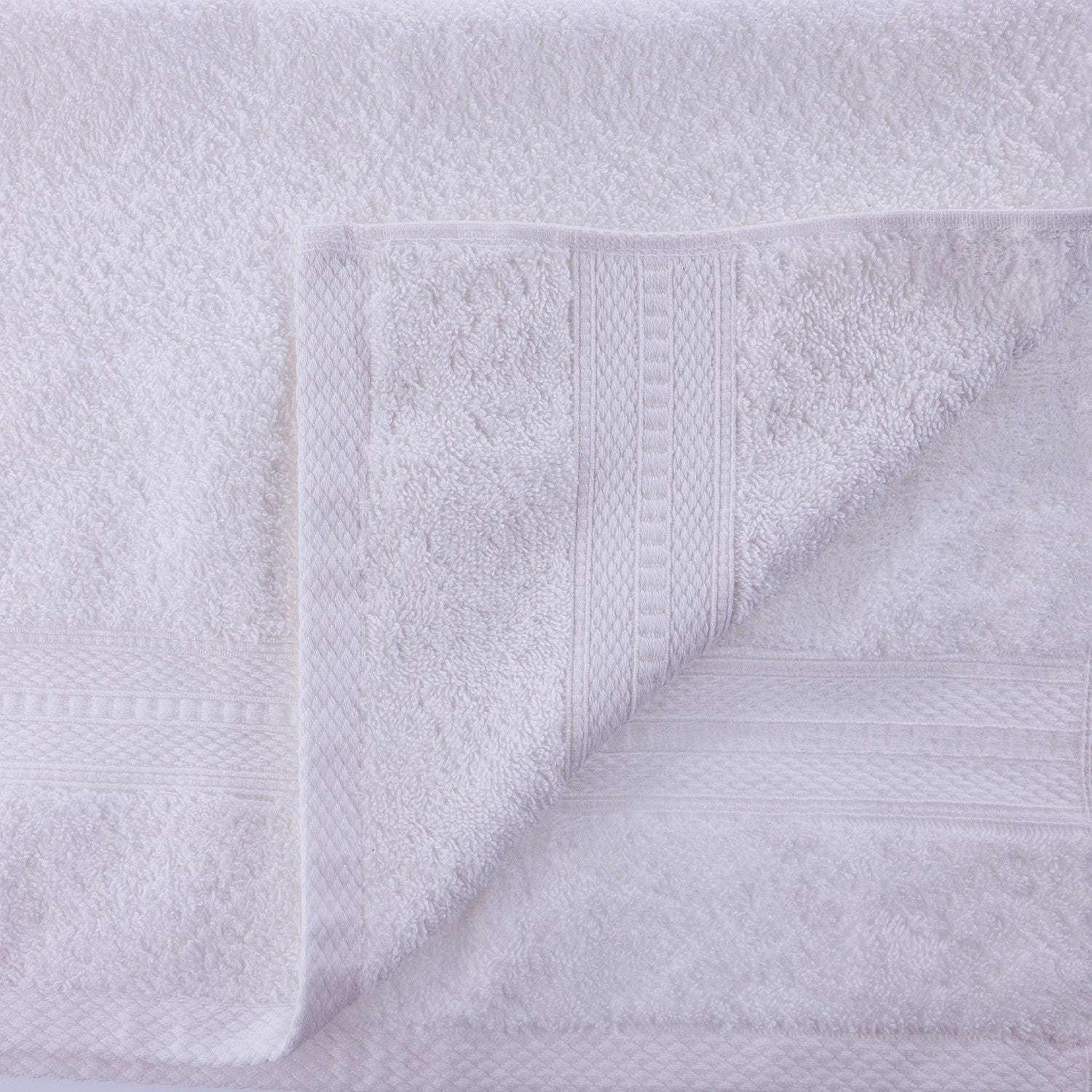 Close-up of a textured white towel with a subtle pattern