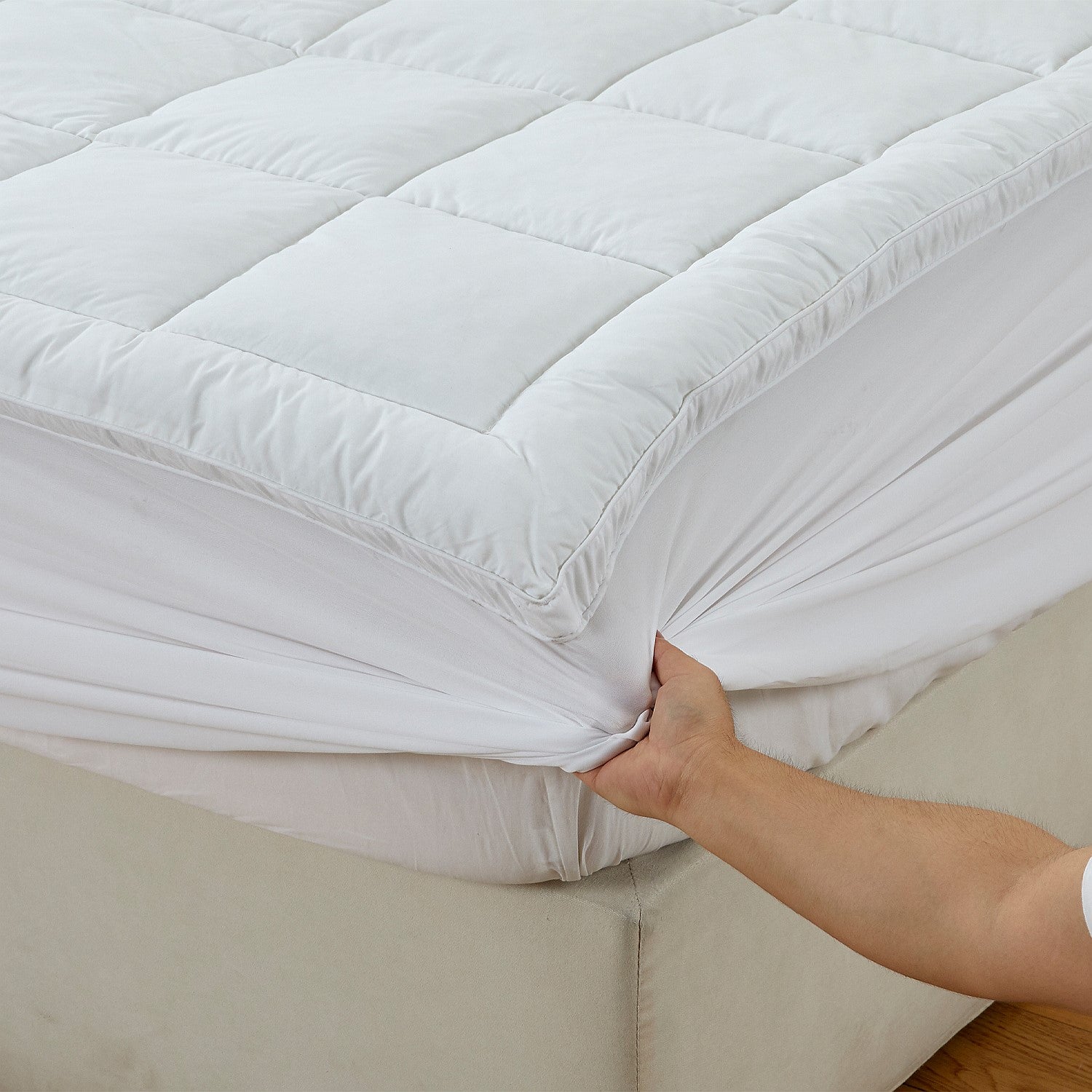 Close up of Cluster Puff Mattress Topper corner to show the fully fitted design 